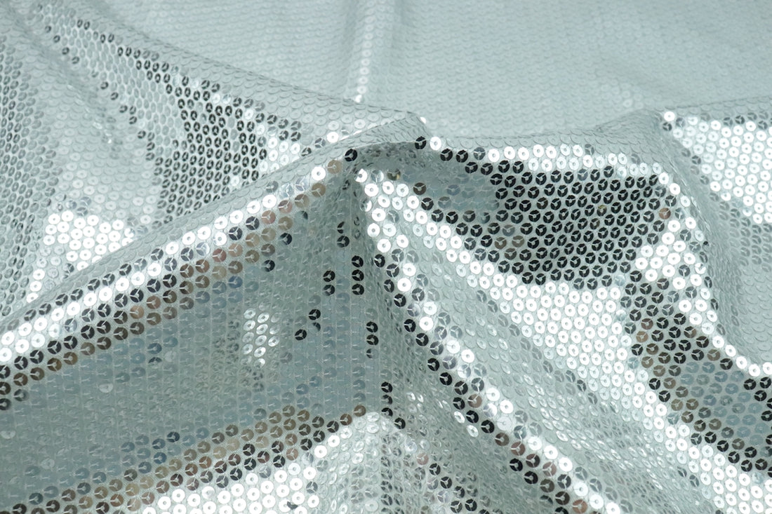 a close up of a white fabric with a design on it