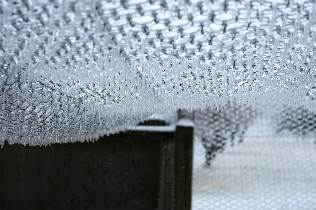 a close up of a curtain with water drops on it
