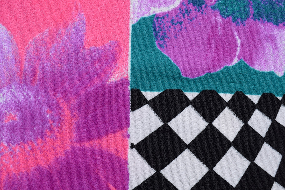 a close up of a piece of cloth with flowers on it