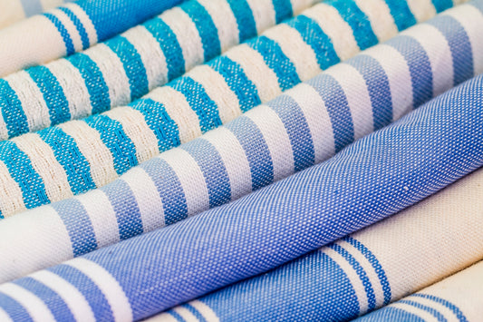a group of blue and white striped fabrics