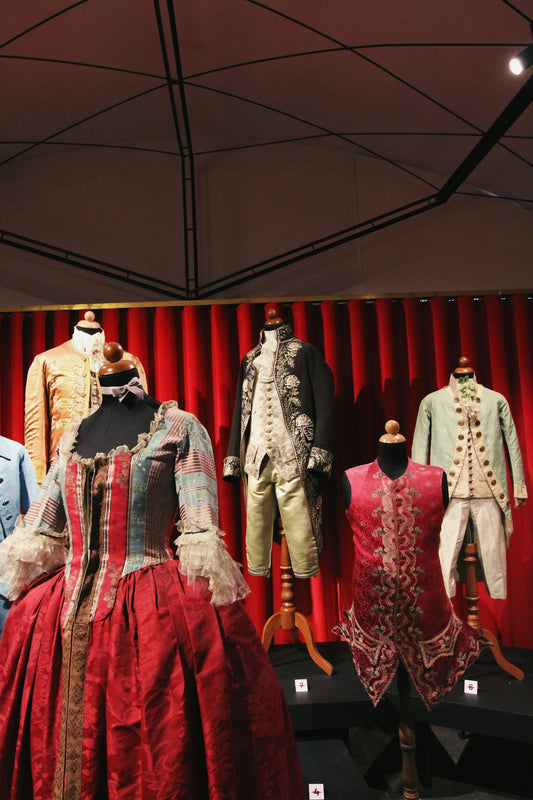 a group of mannequins dressed in historical clothing