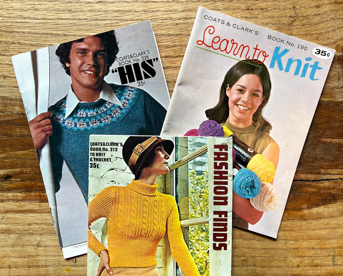 a couple of magazines sitting on top of a wooden table