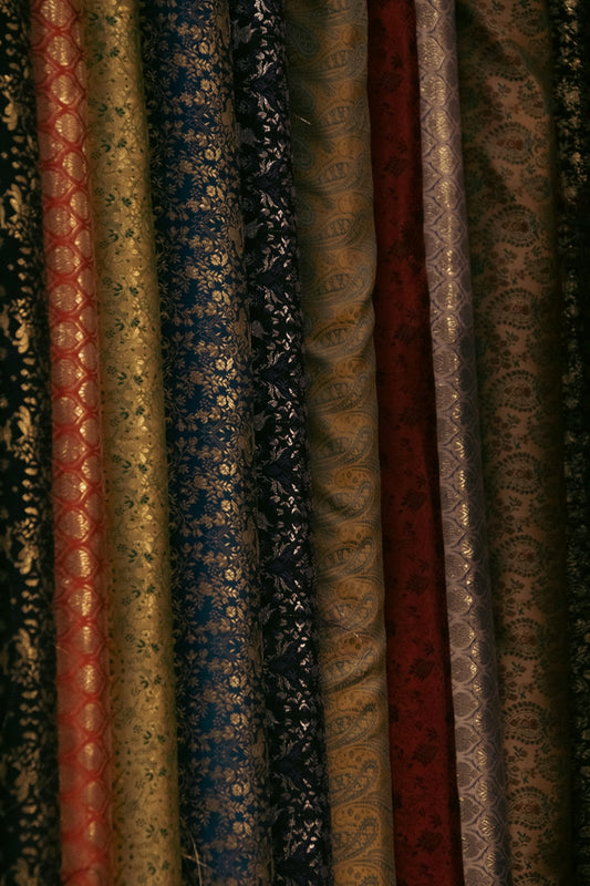 A close up of a bunch of different colored fabrics