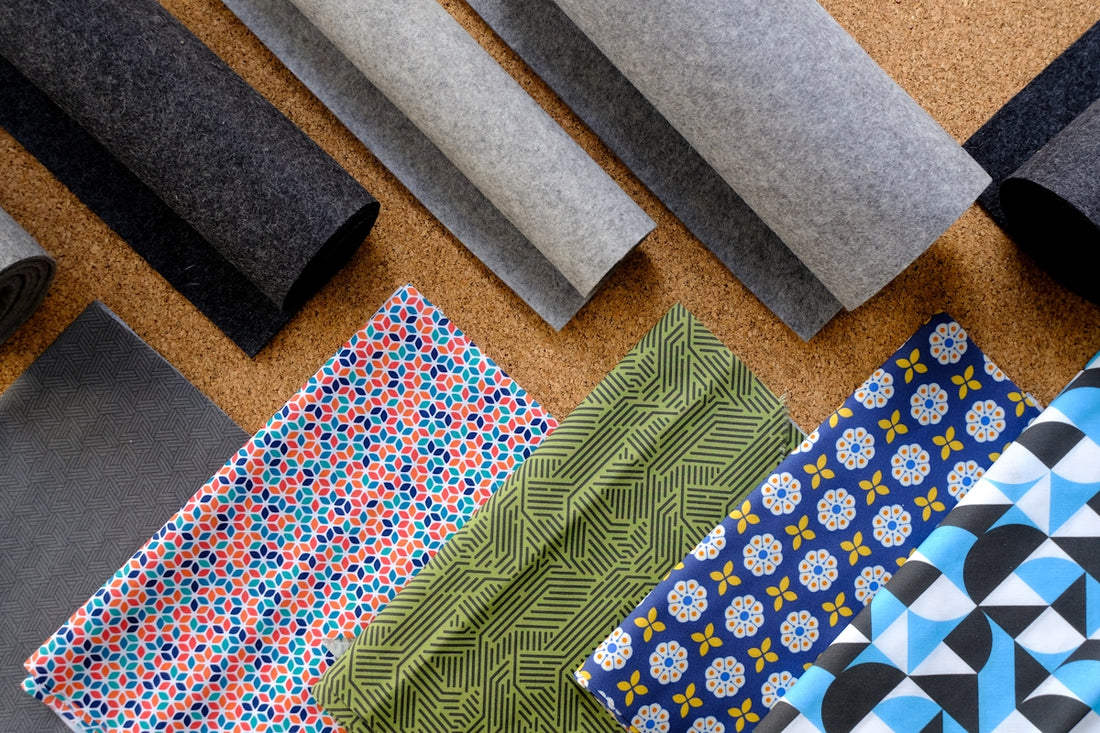 A bunch of different types of fabric on a table