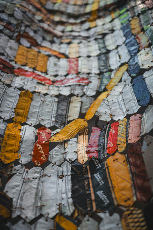 Recycled cans are arranged in a unique pattern.