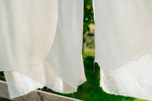 White fabric drying in the sun outdoors