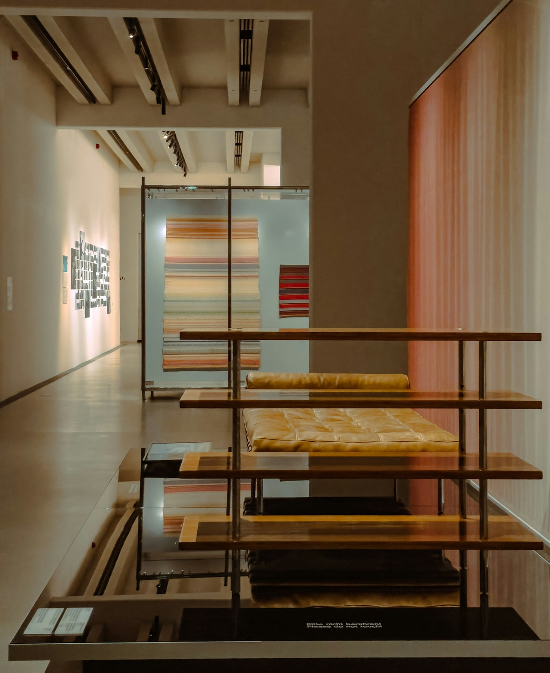 Modern art exhibition with colorful textiles on display